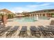 Large community swimming pool with lounge chairs and covered seating areas, perfect for relaxation at 4120 Overcup Oak Ln, Cary, NC 27519