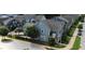 Aerial view of this house showing the surrounding trees and the adjacent street at 421 Old Ride Dr, Holly Springs, NC 27540