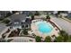 Aerial view of community pool and clubhouse, showcasing its central location and amenities at 421 Old Ride Dr, Holly Springs, NC 27540