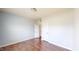 Bedroom with hardwood floors, closet, and dual doors at 421 Old Ride Dr, Holly Springs, NC 27540