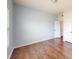 Spacious bedroom with hardwood floors, light blue walls, and white doors at 421 Old Ride Dr, Holly Springs, NC 27540