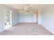 Spacious bedroom with neutral carpet, a ceiling fan, and a convenient en-suite bathroom at 421 Old Ride Dr, Holly Springs, NC 27540