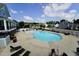 Inviting community pool with ample seating, perfect for relaxation and social gatherings at 421 Old Ride Dr, Holly Springs, NC 27540