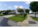 Home featuring an enclosed wrought iron fence, trees, and landscaping at 421 Old Ride Dr, Holly Springs, NC 27540