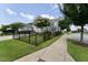 This exterior view shows an enclosed wrought iron fence in the front yard of the home at 421 Old Ride Dr, Holly Springs, NC 27540