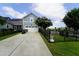 Home with a two-car garage, a well-maintained driveway, and a fenced backyard for privacy at 421 Old Ride Dr, Holly Springs, NC 27540