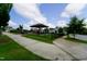Neighborhood playground featuring a gazebo, playground equipment, and a fenced in area at 421 Old Ride Dr, Holly Springs, NC 27540