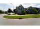 A pleasant street showcasing charming homes, manicured lawns, and mature trees in a friendly neighborhood at 421 Old Ride Dr, Holly Springs, NC 27540