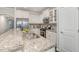 Stylish kitchen with granite countertops, stainless steel appliances, white cabinets and tile backsplash at 43 Salt Cedar Ln, Chapel Hill, NC 27516