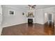 Cozy living room with a decorative fireplace, hardwood floors, and plenty of natural light at 43 Salt Cedar Ln, Chapel Hill, NC 27516