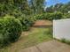 Fenced backyard with lush greenery and patio, ideal for outdoor relaxation at 4719 Altha St, Raleigh, NC 27606