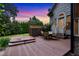 Backyard featuring a hot tub, deck, table with chairs, and a lattice fence at 4720 Yates Mill Pond Rd, Raleigh, NC 27606