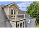 Charming home featuring a balcony with a wrought iron railing and a door leading to the outside at 4720 Yates Mill Pond Rd, Raleigh, NC 27606