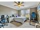 Bedroom with neutral walls, fan, and plenty of light at 4720 Yates Mill Pond Rd, Raleigh, NC 27606