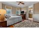 A well-lit bedroom with an ensuite bathroom showcases comfort and style at 4720 Yates Mill Pond Rd, Raleigh, NC 27606