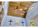 Unique wood-paneled ceiling with fan and light fixture in the home office at 4720 Yates Mill Pond Rd, Raleigh, NC 27606