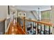 Bright foyer with a clear view of the living spaces below from the upper level landing at 4720 Yates Mill Pond Rd, Raleigh, NC 27606
