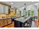 A kitchen features an island with bar stool seating and an adjacent breakfast nook at 4720 Yates Mill Pond Rd, Raleigh, NC 27606
