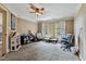 Spacious living room featuring a ceiling fan and windows that provide natural light at 4720 Yates Mill Pond Rd, Raleigh, NC 27606