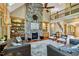 Cozy living room features a stone fireplace, hardwood floors, and built-in bookshelves at 4720 Yates Mill Pond Rd, Raleigh, NC 27606