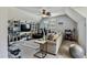 A bonus living room area with neutral color palette, ceiling fan, and ample space for furniture at 4720 Yates Mill Pond Rd, Raleigh, NC 27606