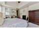 This large main bedroom boasts a fireplace and access to an ensuite bathroom for convenience at 4720 Yates Mill Pond Rd, Raleigh, NC 27606