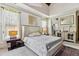 This main bedroom features an ensuite bathroom and sitting area for added luxury and convenience at 4720 Yates Mill Pond Rd, Raleigh, NC 27606