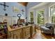 Spacious home office with hardwood floors, large windows, and ample workspace at 4720 Yates Mill Pond Rd, Raleigh, NC 27606