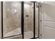 Updated tile shower with glass doors and updated fixtures at 4720 Yates Mill Pond Rd, Raleigh, NC 27606