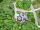 Stunning aerial view of a well-maintained home surrounded by lush greenery and a beautifully landscaped yard at 4924 Stoneyoak Ln, Raleigh, NC 27610