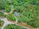 Aerial view highlighting the property boundary and wooded surroundings of the serene home at 4924 Stoneyoak Ln, Raleigh, NC 27610