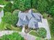 A high aerial view showcases the home and the gorgeous trees surrounding the property at 4924 Stoneyoak Ln, Raleigh, NC 27610