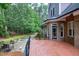 The back deck is just outside the home and a stone pathway and sitting area are featured in the backyard at 4924 Stoneyoak Ln, Raleigh, NC 27610