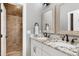Elegant bathroom with granite countertop, double sinks, and a glass-enclosed shower at 4924 Stoneyoak Ln, Raleigh, NC 27610
