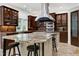 Gourmet kitchen with stainless steel appliances, range hood and granite countertops at 4924 Stoneyoak Ln, Raleigh, NC 27610