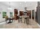 Bright kitchen featuring a large center island, stainless steel appliances, and casual dining space at 4924 Stoneyoak Ln, Raleigh, NC 27610