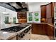 Close-up of gourmet kitchen with custom cabinetry and stainless steel appliances at 4924 Stoneyoak Ln, Raleigh, NC 27610