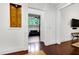 Open doorway leading to a sitting room with natural light and a comfortable seating area at 4924 Stoneyoak Ln, Raleigh, NC 27610