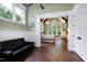 Spacious main bedroom featuring tile floors, stylish furniture, and plenty of natural light at 4924 Stoneyoak Ln, Raleigh, NC 27610