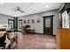 Spacious office featuring a ceiling fan, unique flooring, and natural light from multiple windows at 4924 Stoneyoak Ln, Raleigh, NC 27610
