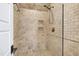 Walk-in shower with tile walls and pebble flooring at 4924 Stoneyoak Ln, Raleigh, NC 27610