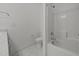 This bathroom features a tiled floor, toilet, and a bathtub with shower head at 5034 Blendon Trl, Garner, NC 27529