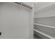 Walk-in closet featuring built-in shelving and a clothing rod at 5034 Blendon Trl, Garner, NC 27529
