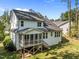 This charming home features a screened-in porch and a well-maintained lawn at 5034 Blendon Trl, Garner, NC 27529