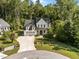 A beautiful two-story home surrounded by mature trees with an inviting front porch and ample parking at 5034 Blendon Trl, Garner, NC 27529