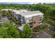 Apartment complex features modern architecture, lush landscaping, and ample parking at 515 N Churton St # 203, Hillsborough, NC 27278