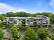 A view of the modern apartment complex with parking and manicured landscaping at 515 N Churton St # 203, Hillsborough, NC 27278