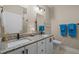 Modern bathroom with double sinks, granite countertops, and white cabinetry at 515 N Churton St # 203, Hillsborough, NC 27278