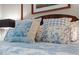 A close-up of the bed featuring designer pillows in a bedroom setting at 515 N Churton St # 203, Hillsborough, NC 27278
