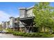 Modern building with neutral tones, balconies and lush landscaping for a contemporary feel at 515 N Churton St # 203, Hillsborough, NC 27278